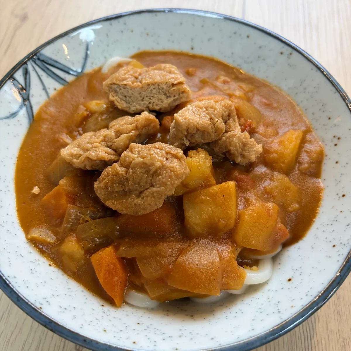Curry Udon with Inari Tofu (Vegan) - Japanese dish at Iyasaka Cafe